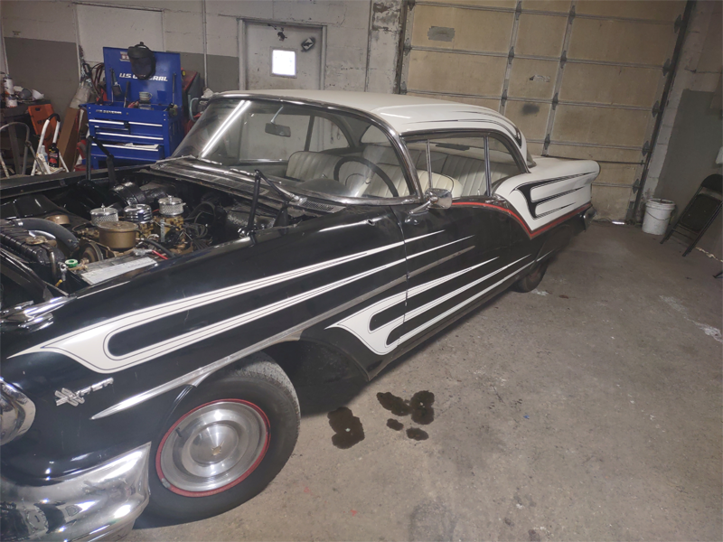 Classic 1950s hot rod in garage workshop